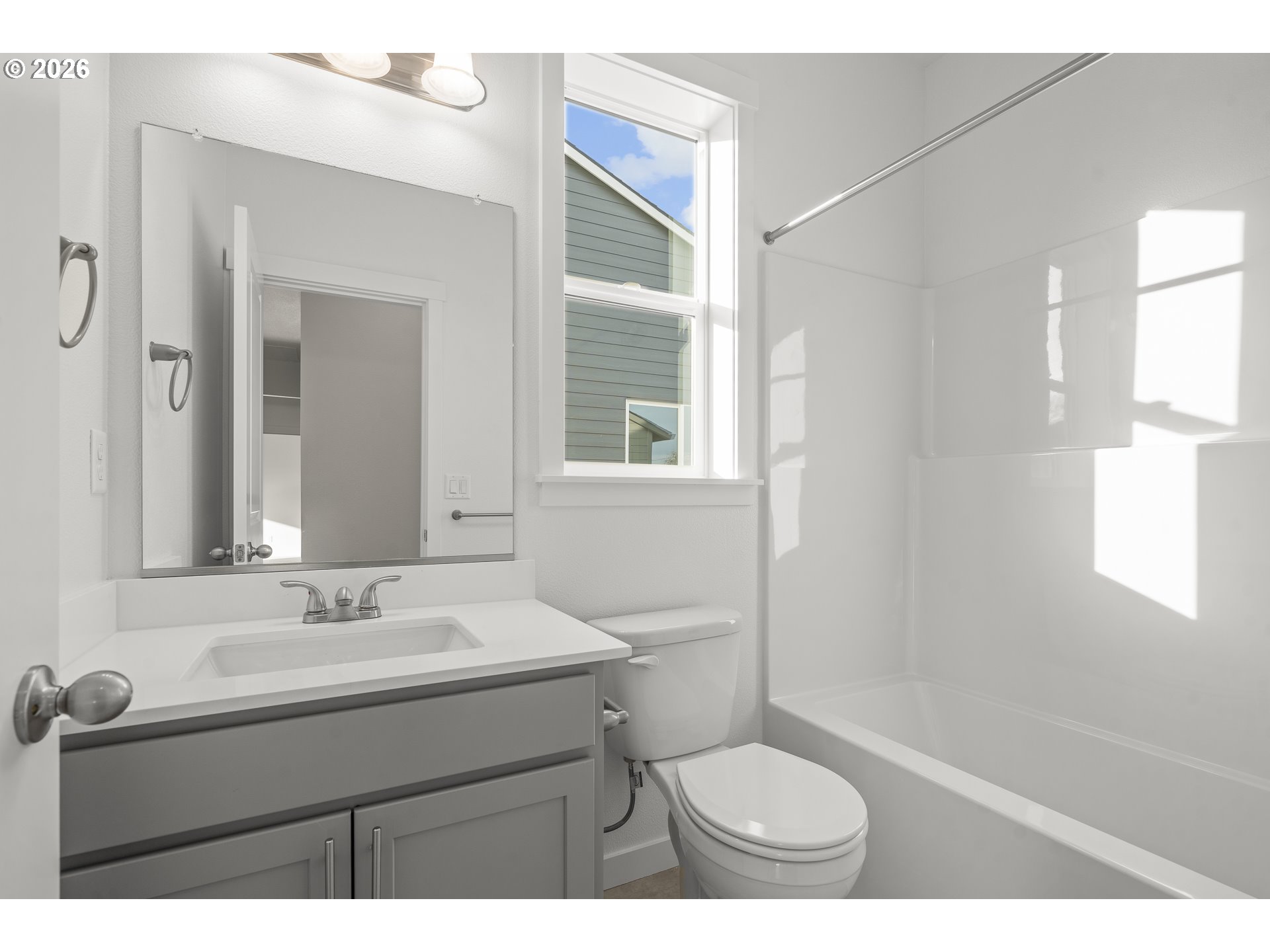 673 Parker Loop Silverton, OR 97381 - Photo 28 of 37 a bathroom with a sink toilet a mirror and shower
