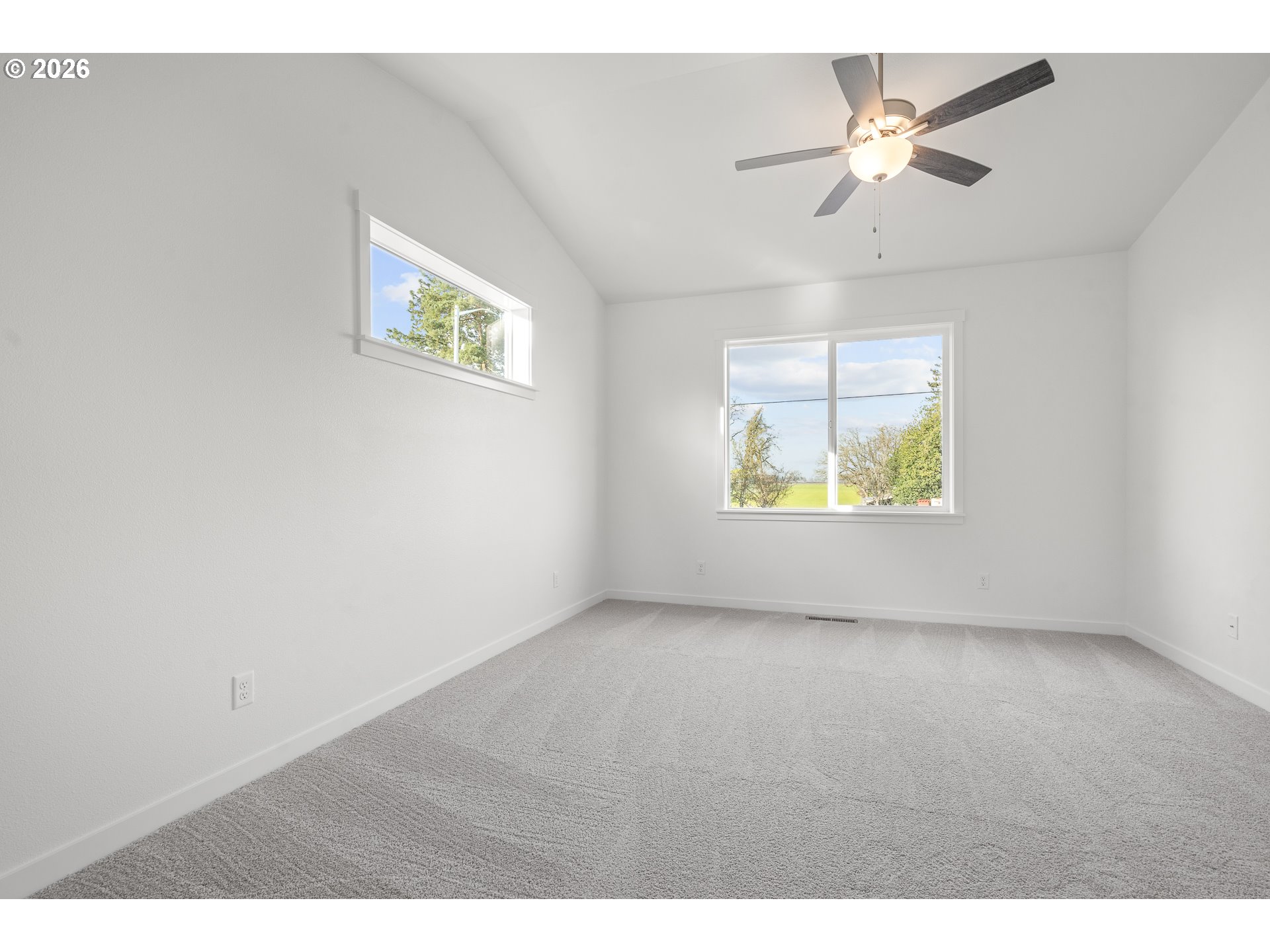 673 Parker Loop Silverton, OR 97381 - Photo 31 of 37 an empty room with fan and windows