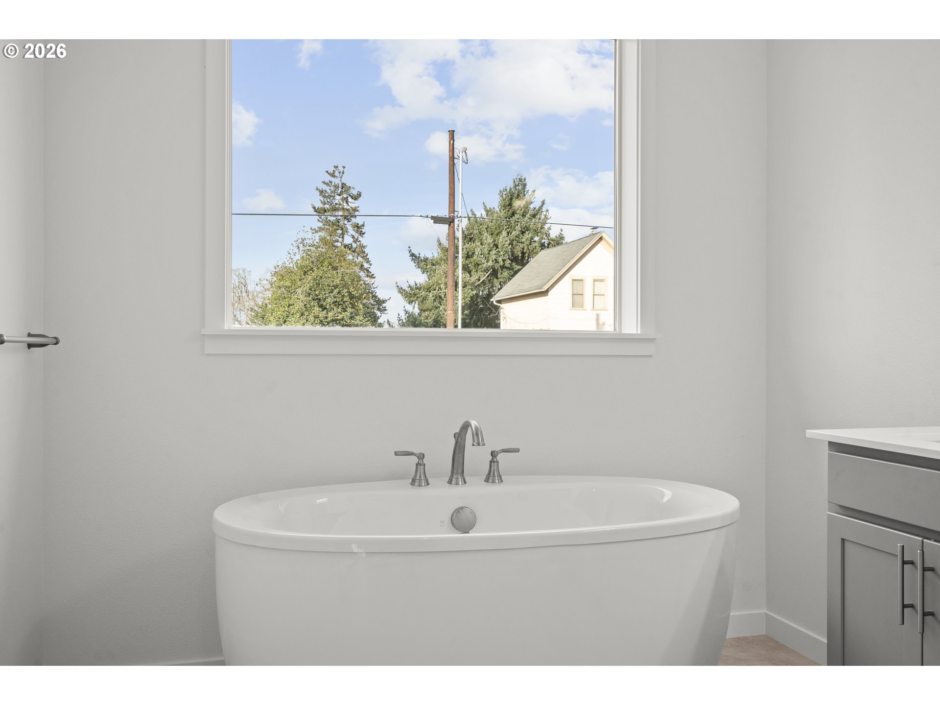 673 Parker Loop Silverton, OR 97381 - Photo 35 of 37 a bathroom with a sink and a window