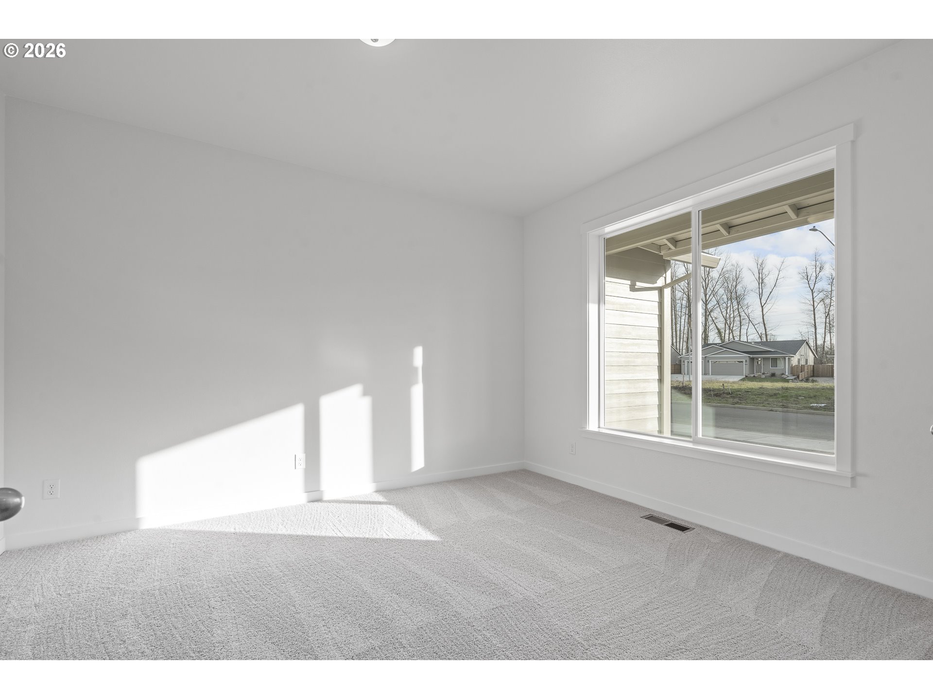 673 Parker Loop Silverton, OR 97381 - Photo 8 of 37 a view of an empty room with a window