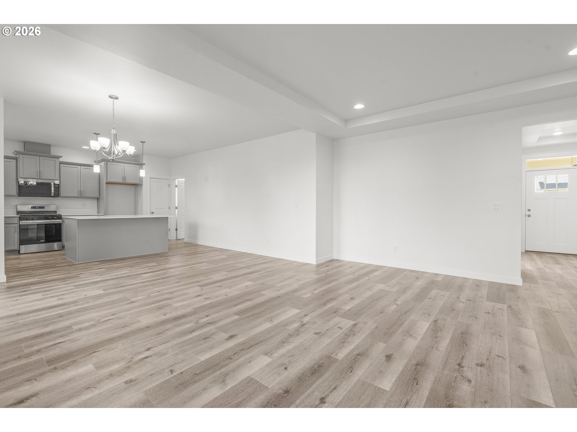 673 Parker Loop Silverton, OR 97381 - Photo 10 of 37 a view of a room with kitchen and wooden floor
