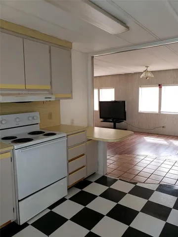 a kitchen with a stove and a sink