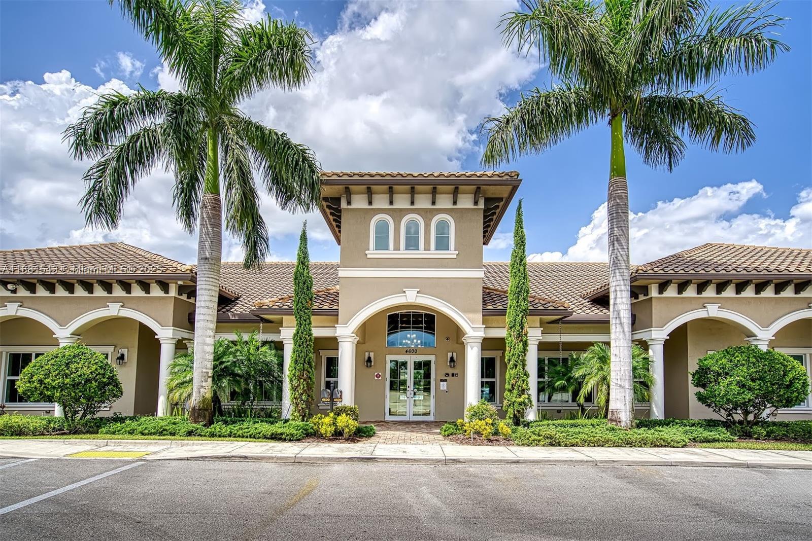 5060 Eucalyptus Drive, Unit 2 Hollywood, FL 33021 - Photo 13 of 43 front view of a house with a garden