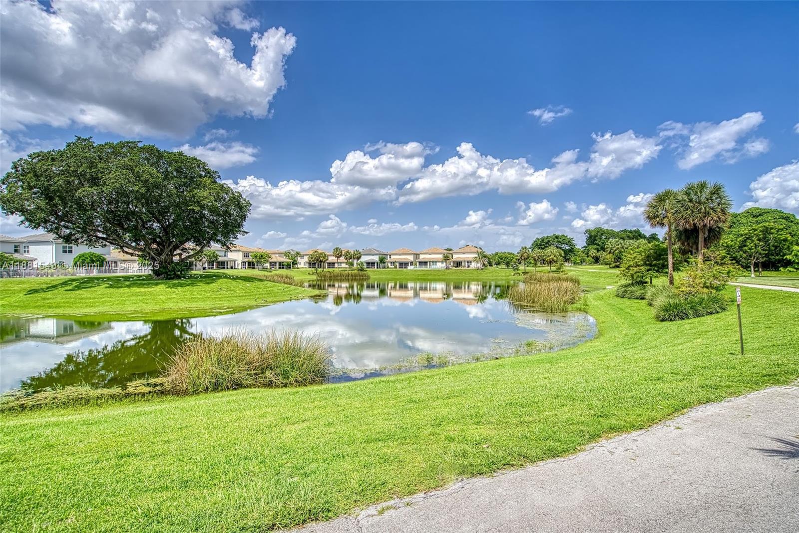 5060 Eucalyptus Drive, Unit 2 Hollywood, FL 33021 - Photo 14 of 43 a view of a golf course with a garden