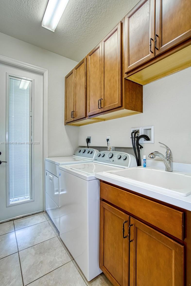 5060 Eucalyptus Drive, Unit 2 Hollywood, FL 33021 - Photo 18 of 43 a kitchen with stainless steel appliances granite countertop a sink and cabinets