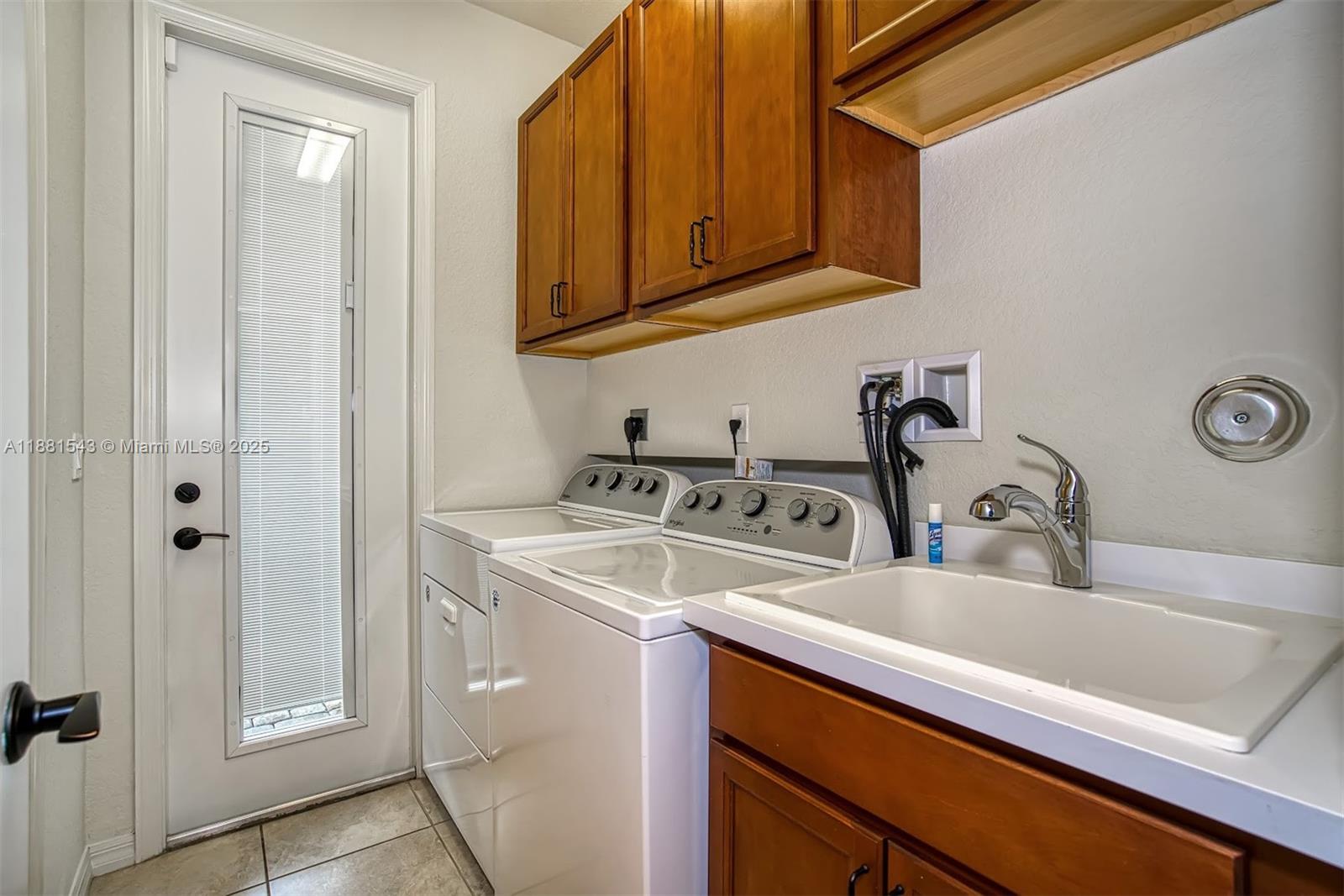 5060 Eucalyptus Drive, Unit 2 Hollywood, FL 33021 - Photo 19 of 43 a bathroom with a sink and a mirror