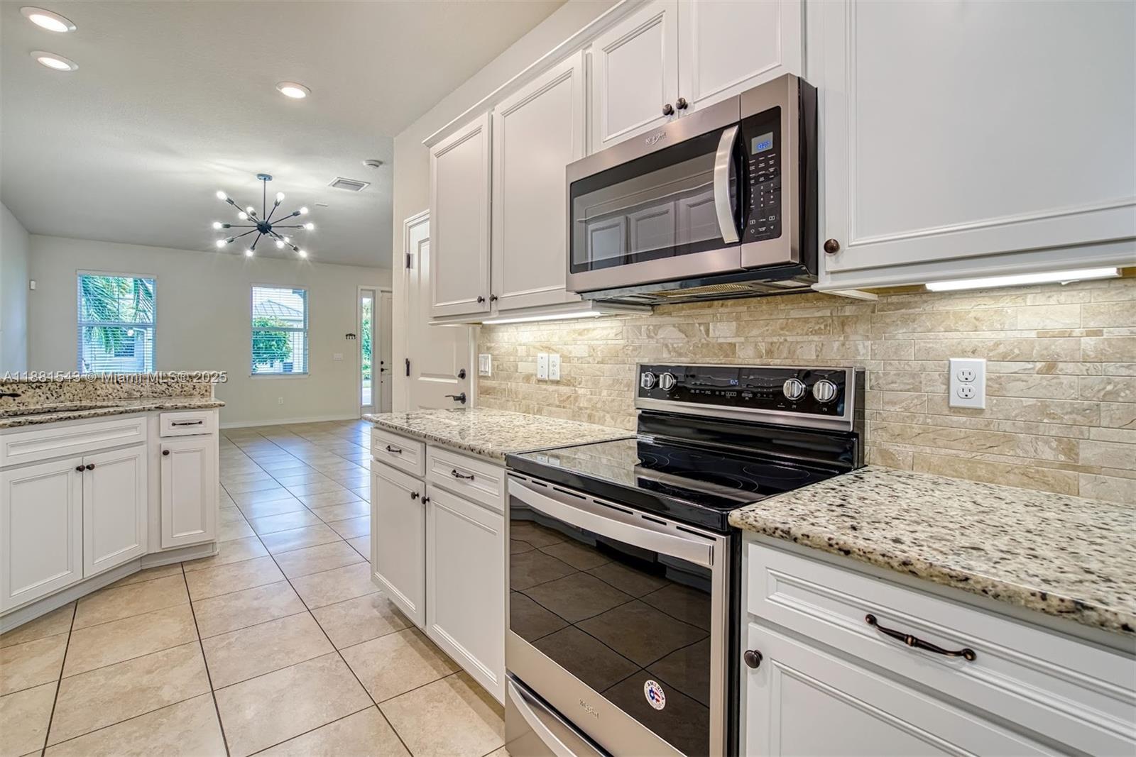 5060 Eucalyptus Drive, Unit 2 Hollywood, FL 33021 - Photo 2 of 43 a kitchen with cabinets appliances and a counter space