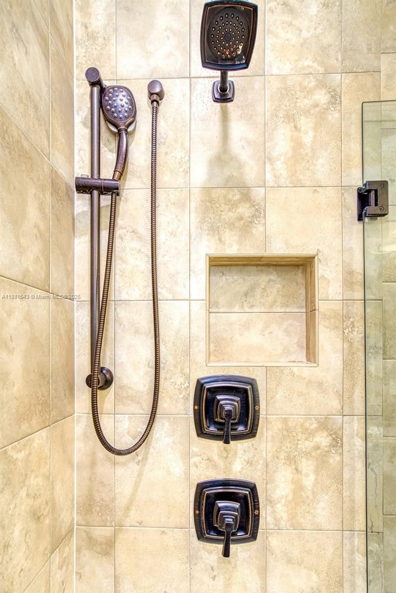 5060 Eucalyptus Drive, Unit 2 Hollywood, FL 33021 - Photo 25 of 43 a picture of a bathroom with a shower and a sink