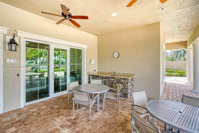a view of swimming pool with a table and chairs