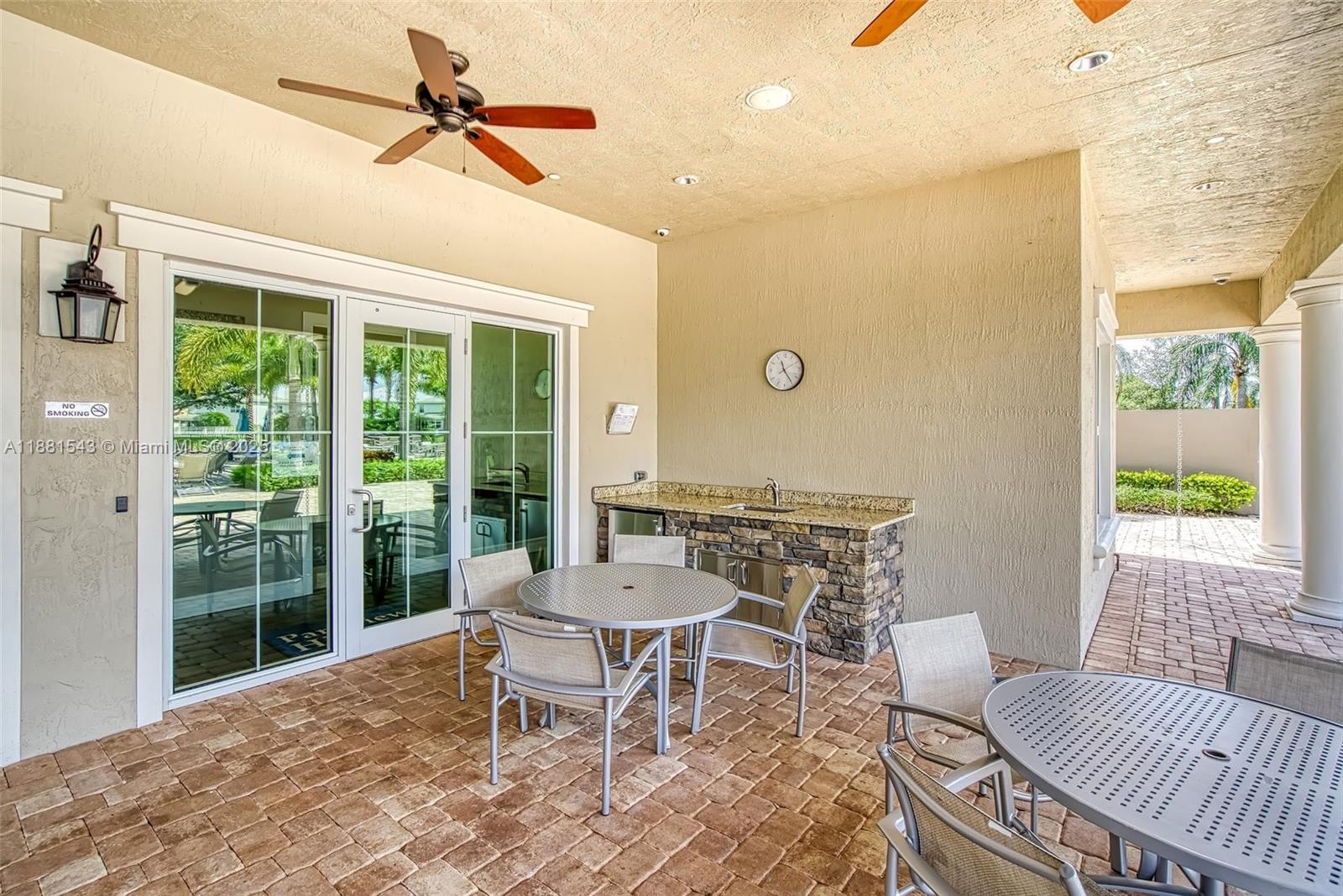 5060 Eucalyptus Drive, Unit 2 Hollywood, FL 33021 - Photo 32 of 43 a living room with a couch and a table