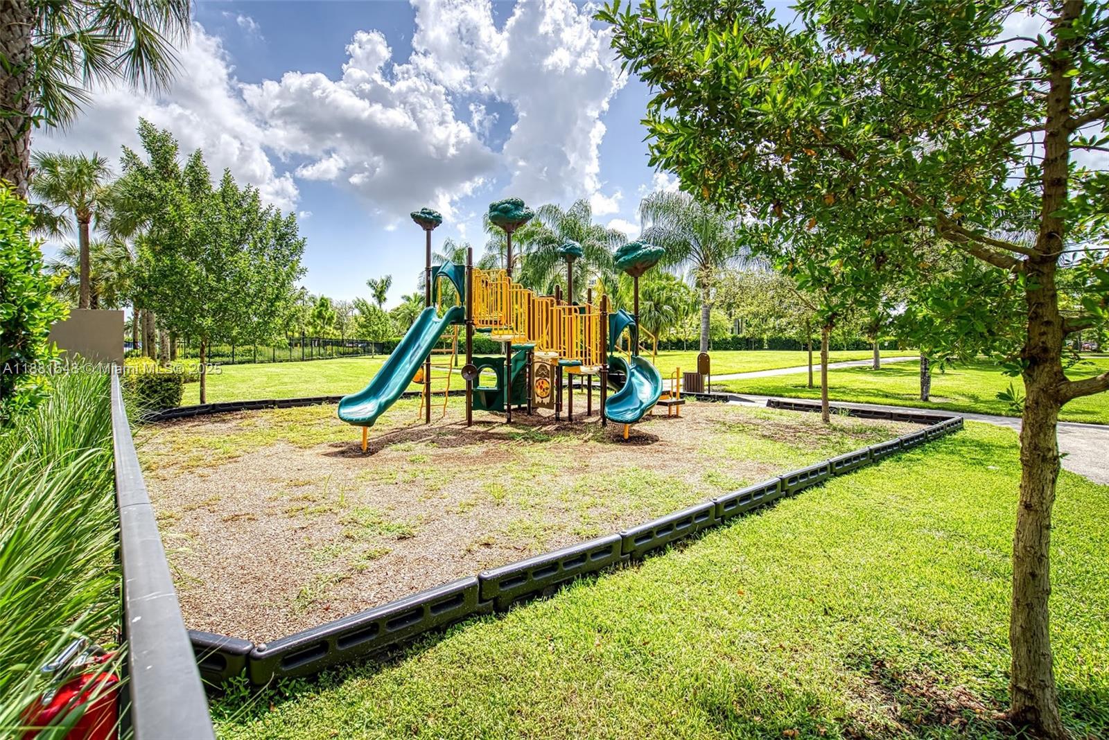 5060 Eucalyptus Drive, Unit 2 Hollywood, FL 33021 - Photo 34 of 43 a view of a park with swings