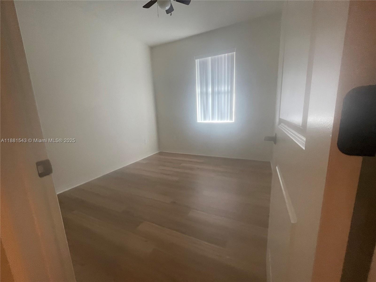 5060 Eucalyptus Drive, Unit 2 Hollywood, FL 33021 - Photo 39 of 43 a view of empty room with windows