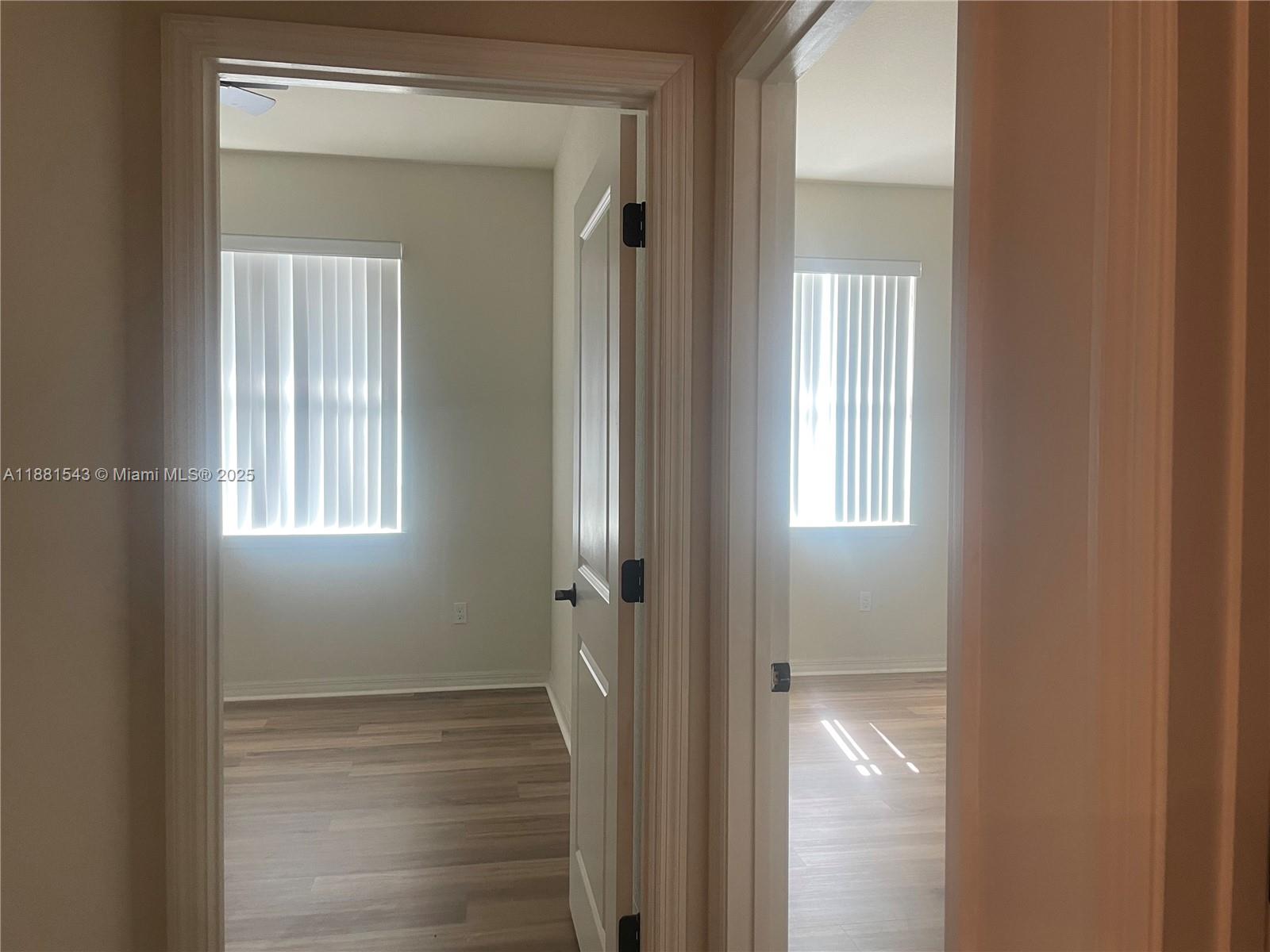 5060 Eucalyptus Drive, Unit 2 Hollywood, FL 33021 - Photo 4 of 43 a view of a bathroom from a hallway