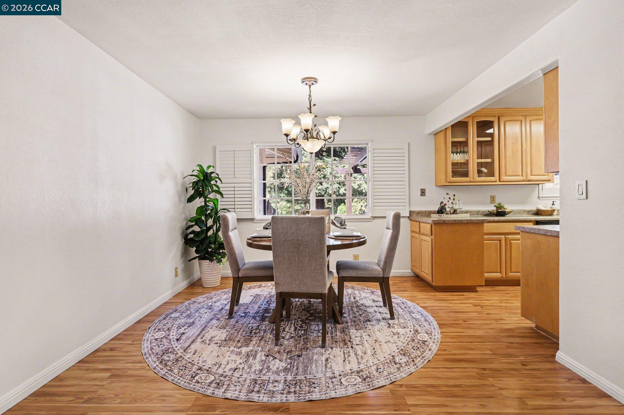 1451 Franklin Canyon Road Martinez, CA 94553 - Photo 11 of 45 a dining room with furniture a chandelier and wooden floor