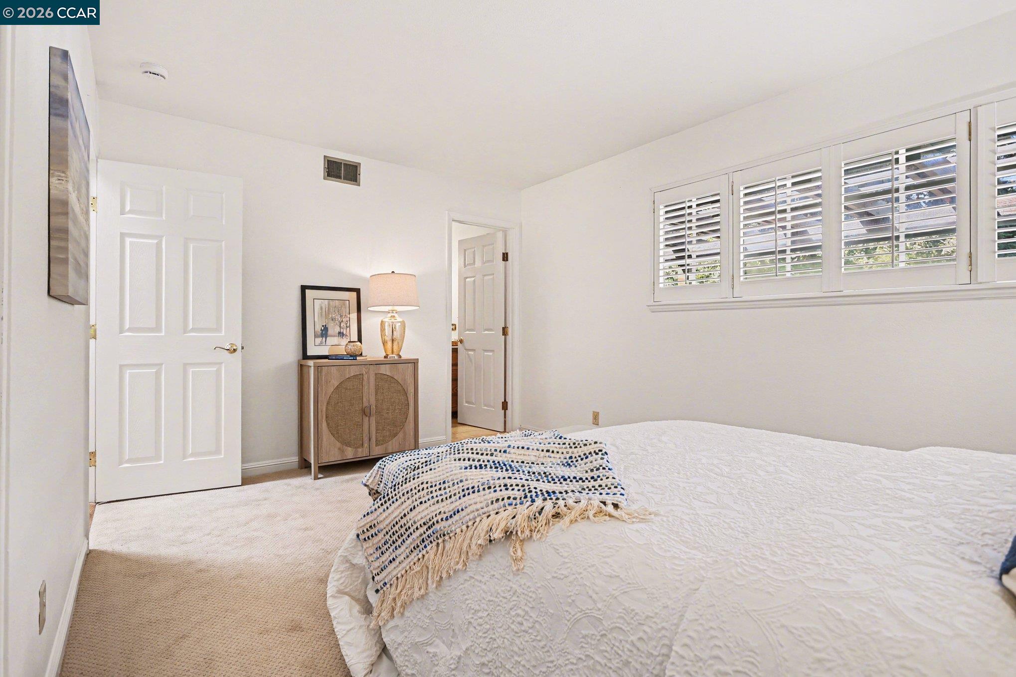 1451 Franklin Canyon Road Martinez, CA 94553 - Photo 18 of 45 a bedroom with a bed and closet with mirror