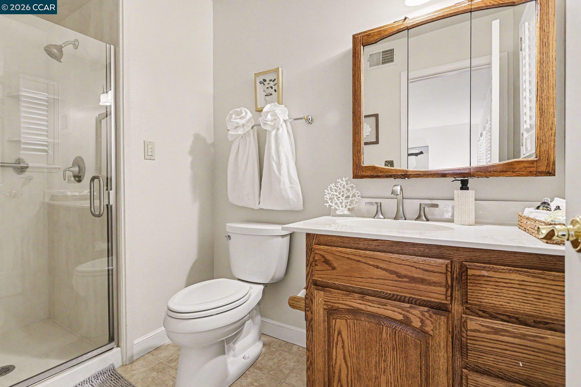 1451 Franklin Canyon Road Martinez, CA 94553 - Photo 19 of 45 a bathroom with a sink a toilet and shower