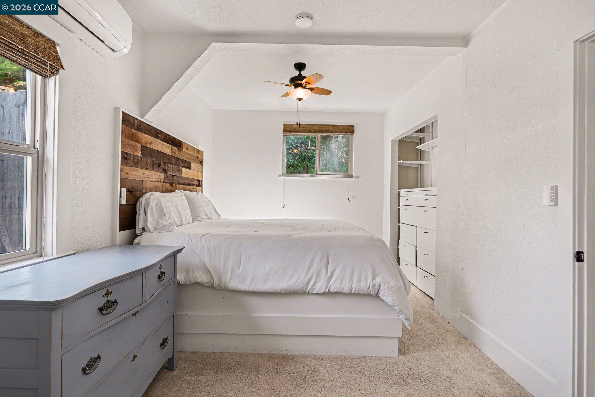 1451 Franklin Canyon Road Martinez, CA 94553 - Photo 34 of 45 a bedroom with a bed and a large window