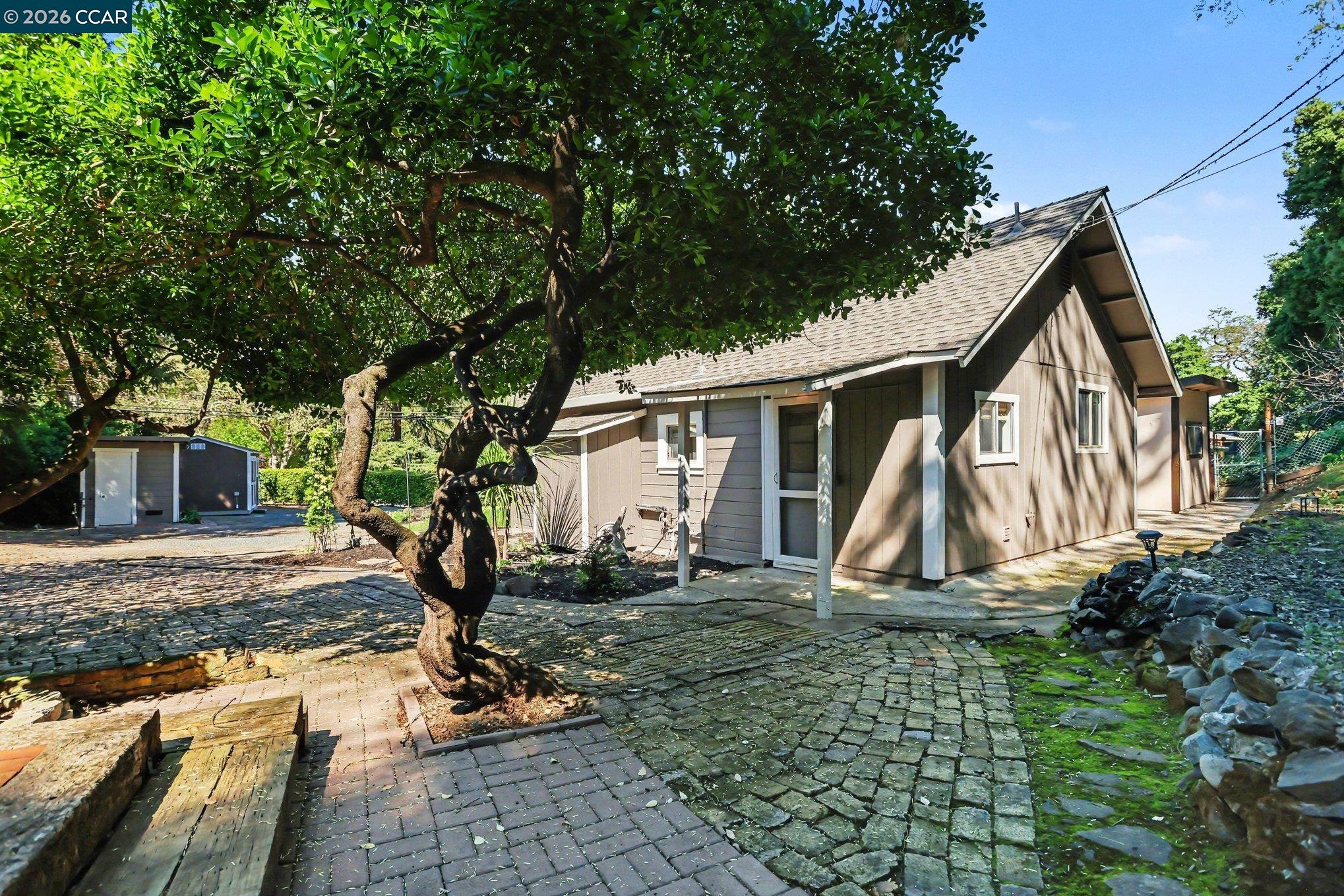 1451 Franklin Canyon Road Martinez, CA 94553 - Photo 38 of 45 a view of a house with backyard and a tree
