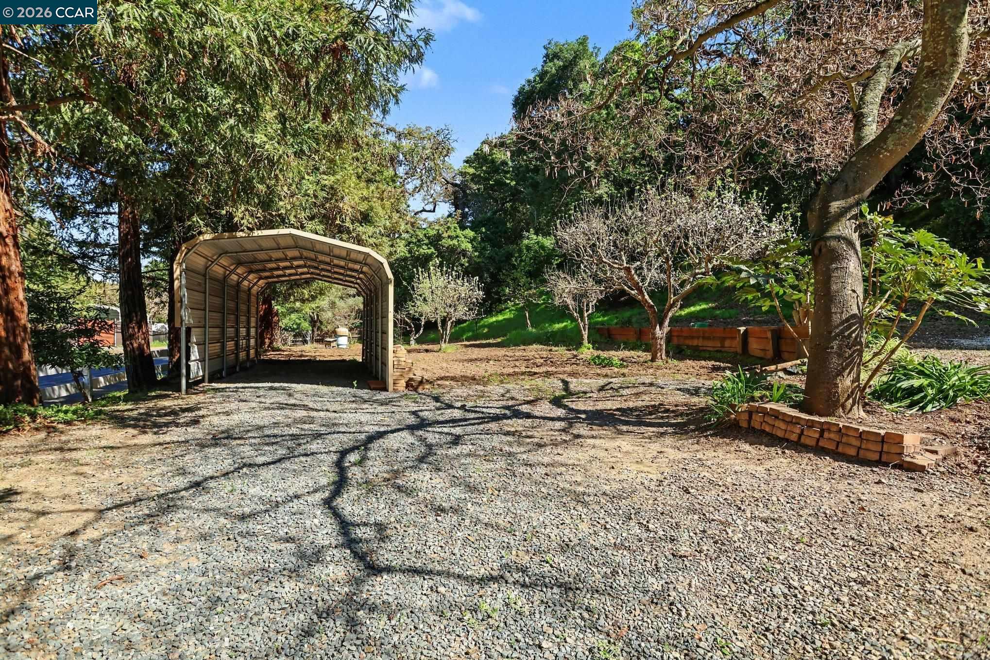 1451 Franklin Canyon Road Martinez, CA 94553 - Photo 40 of 45 a backyard of a house with barbeque oven table and chairs