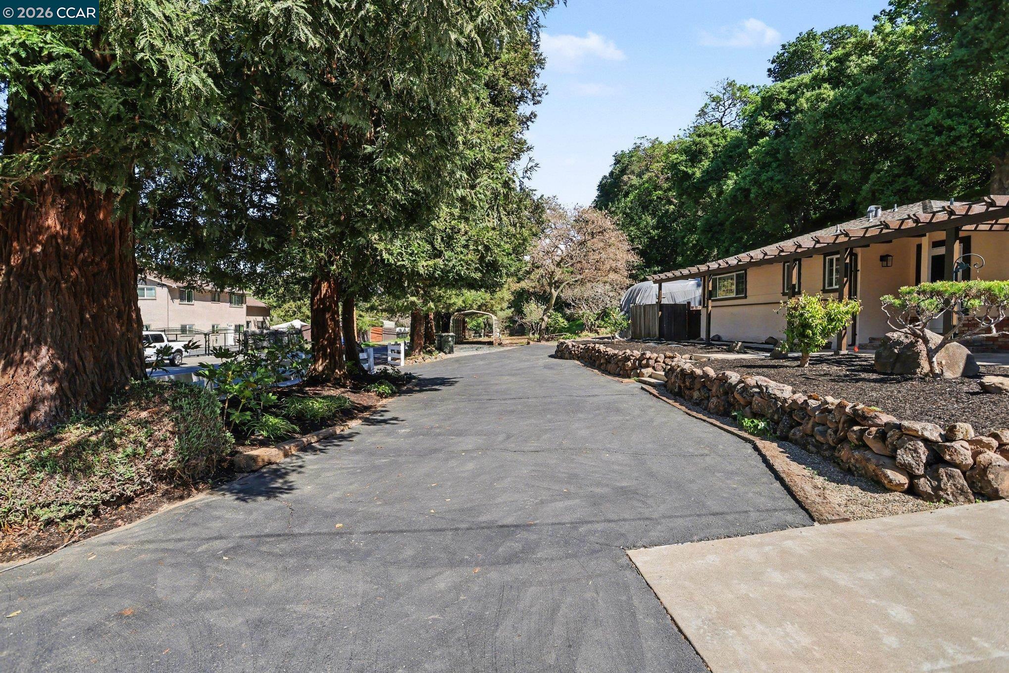 1451 Franklin Canyon Road Martinez, CA 94553 - Photo 4 of 45 a pathway of a house with a yard