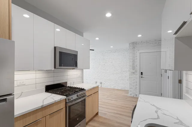 a kitchen with a stove and a microwave