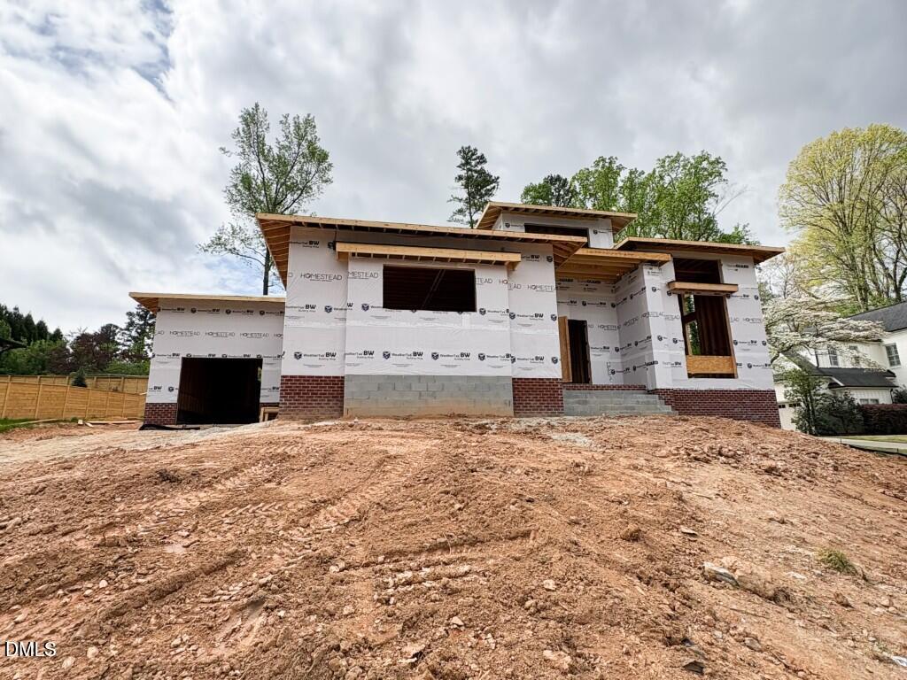 961 Wimbleton Drive Raleigh, NC 27609 - Photo 3 of 38 a view of a house with a yard
