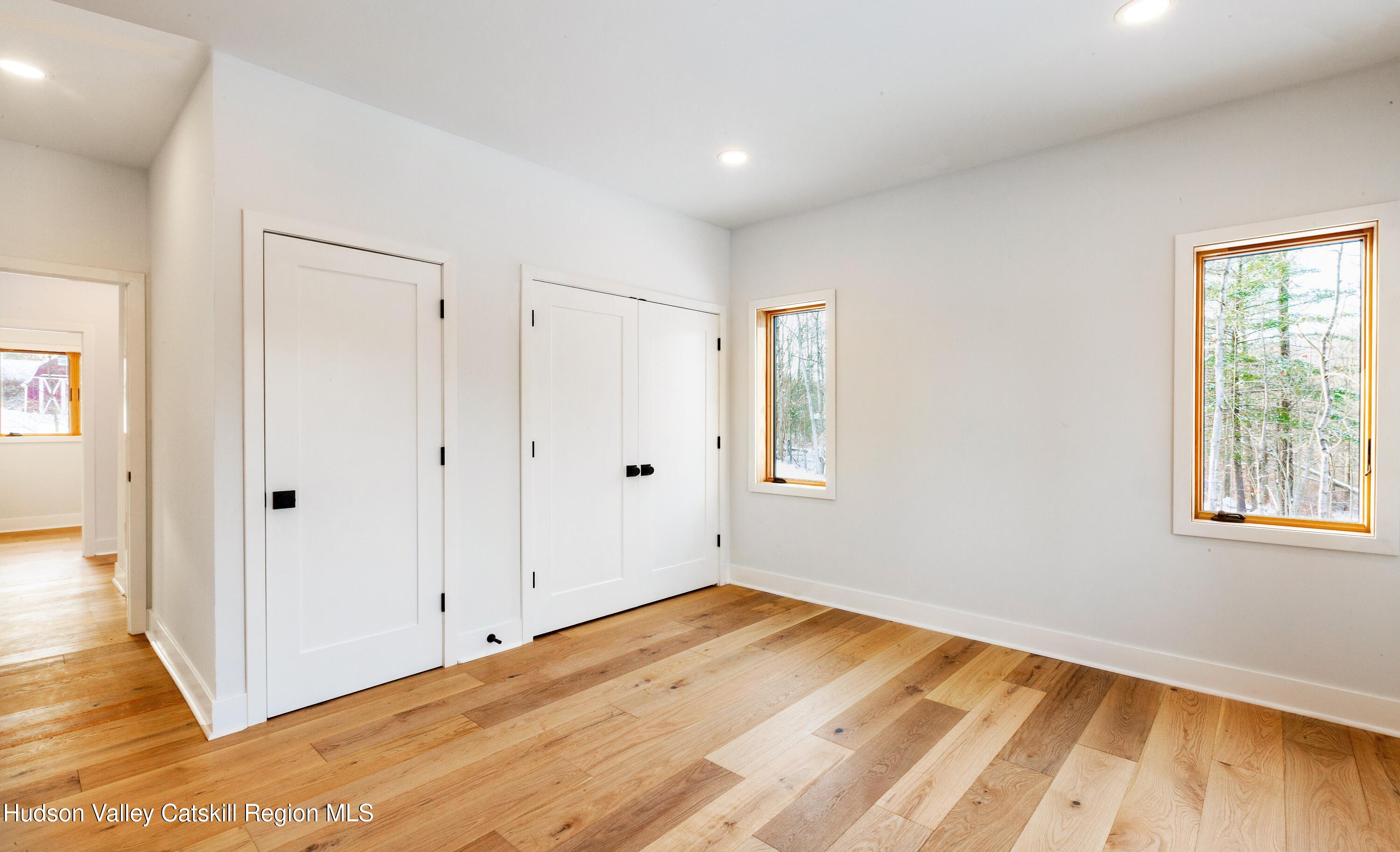 513 Myrtle Avenue Wallkill, NY 12589 - Photo 20 of 62 a view of empty room with wooden floor and fan