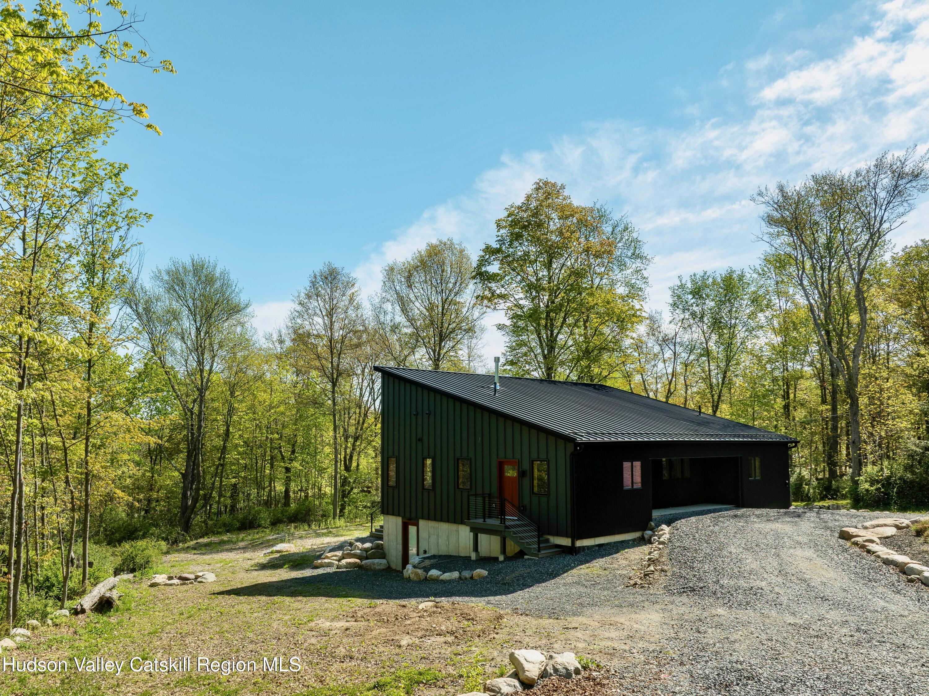 513 Myrtle Avenue Wallkill, NY 12589 - Photo 45 of 62 a view of a barn in the middle of a yard