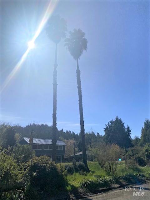 15150 River Road Guerneville, CA 95446 - Photo 2 of 4 a view of a city with tall buildings and a street sign next to a road