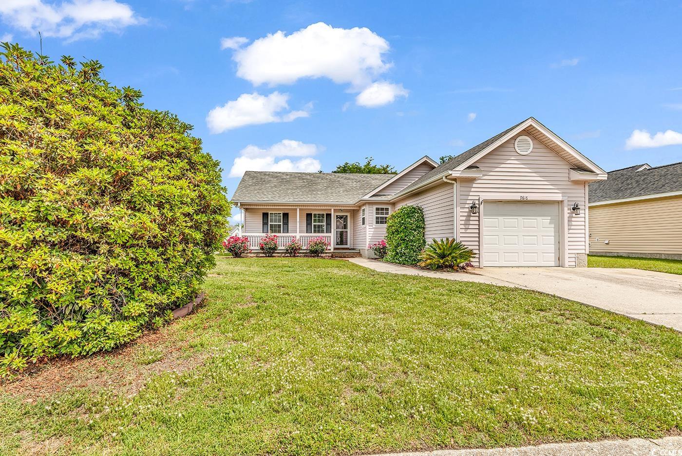 9616 Sullivan Drive Murrells Inlet, SC 29576 - Photo 1 of 23 Single story home with concrete driveway, an attac