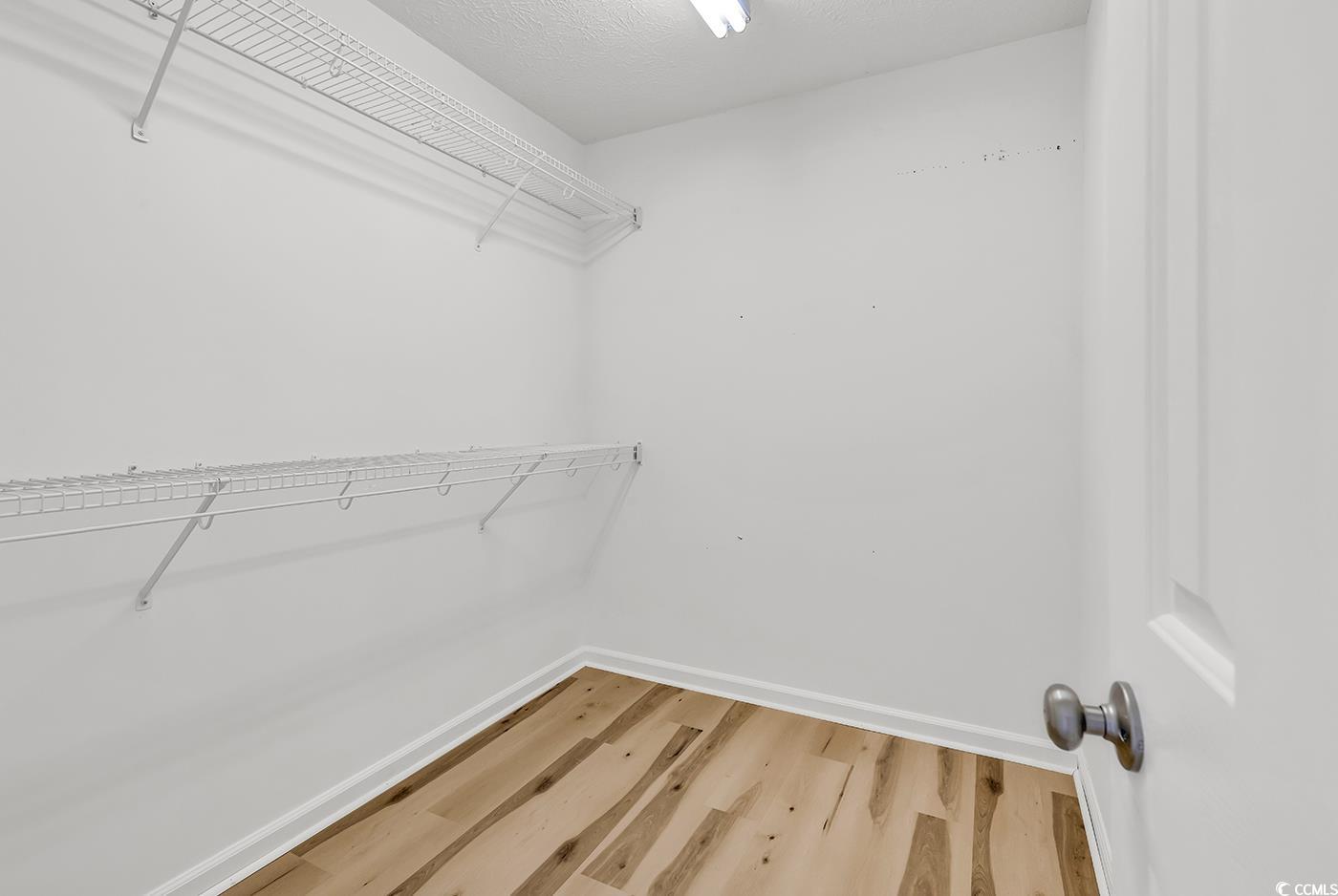 9616 Sullivan Drive Murrells Inlet, SC 29576 - Photo 14 of 23 Spacious closet featuring light wood-style floorin