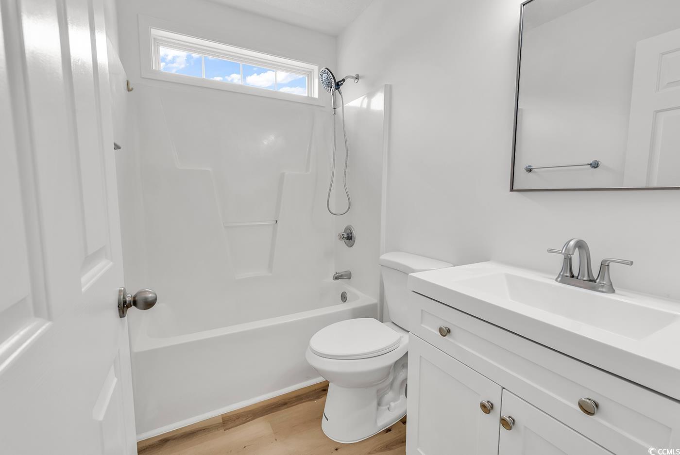 9616 Sullivan Drive Murrells Inlet, SC 29576 - Photo 18 of 23 Bathroom featuring shower / bath combination, wood