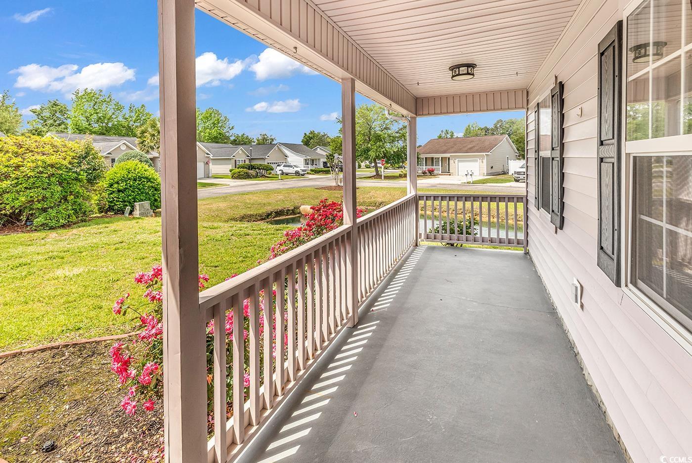 9616 Sullivan Drive Murrells Inlet, SC 29576 - Photo 19 of 23 View of patio featuring a porch and a residential