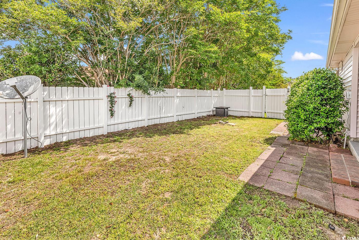 9616 Sullivan Drive Murrells Inlet, SC 29576 - Photo 20 of 23 View of yard featuring a fenced backyard