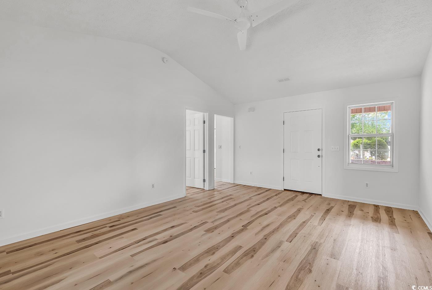 9616 Sullivan Drive Murrells Inlet, SC 29576 - Photo 8 of 23 Interior space with a ceiling fan, baseboards, vau