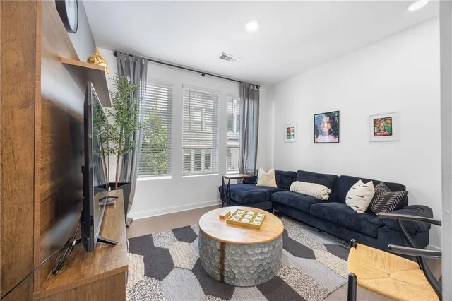 a bathroom with a double vanity sink toilet and shower