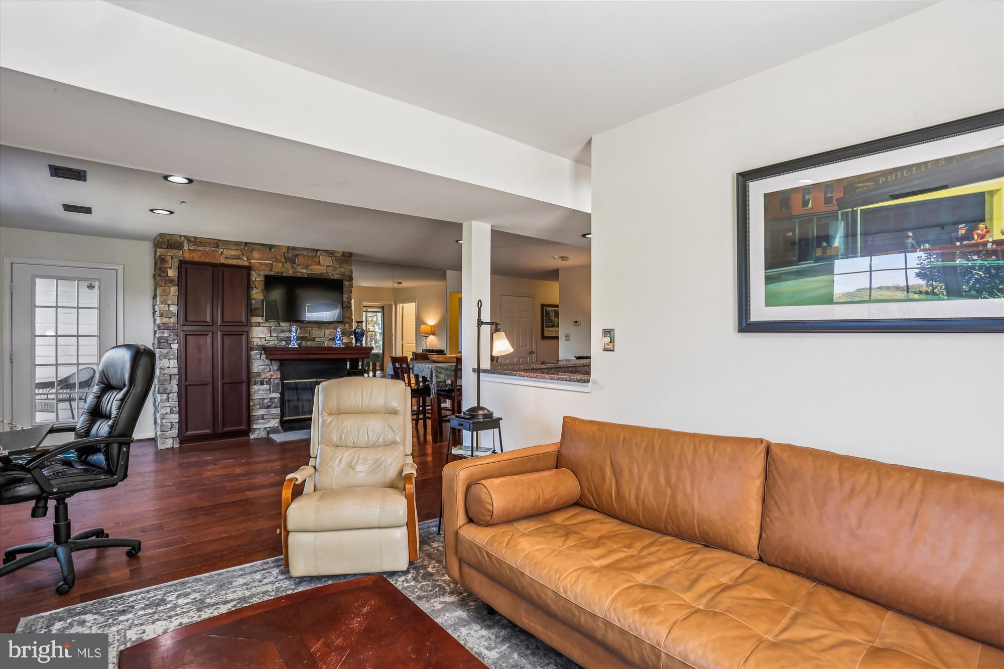 302 Ridgepoint Place, Unit 16 Gaithersburg, MD 20878 - Photo 13 of 40 a living room with furniture and wooden floor