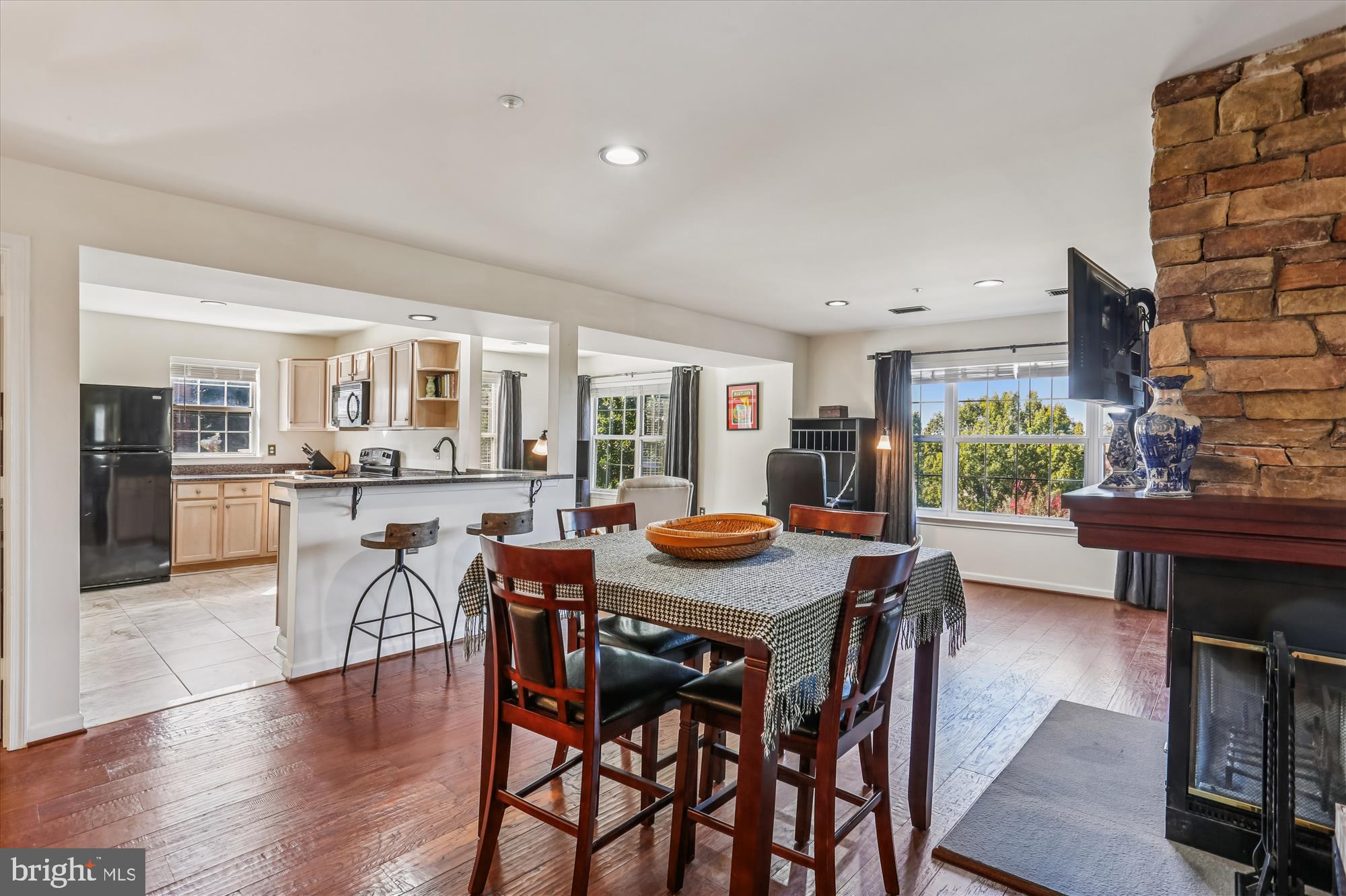 302 Ridgepoint Place, Unit 16 Gaithersburg, MD 20878 - Photo 2 of 40 a view of a dining room with furniture and wooden floor