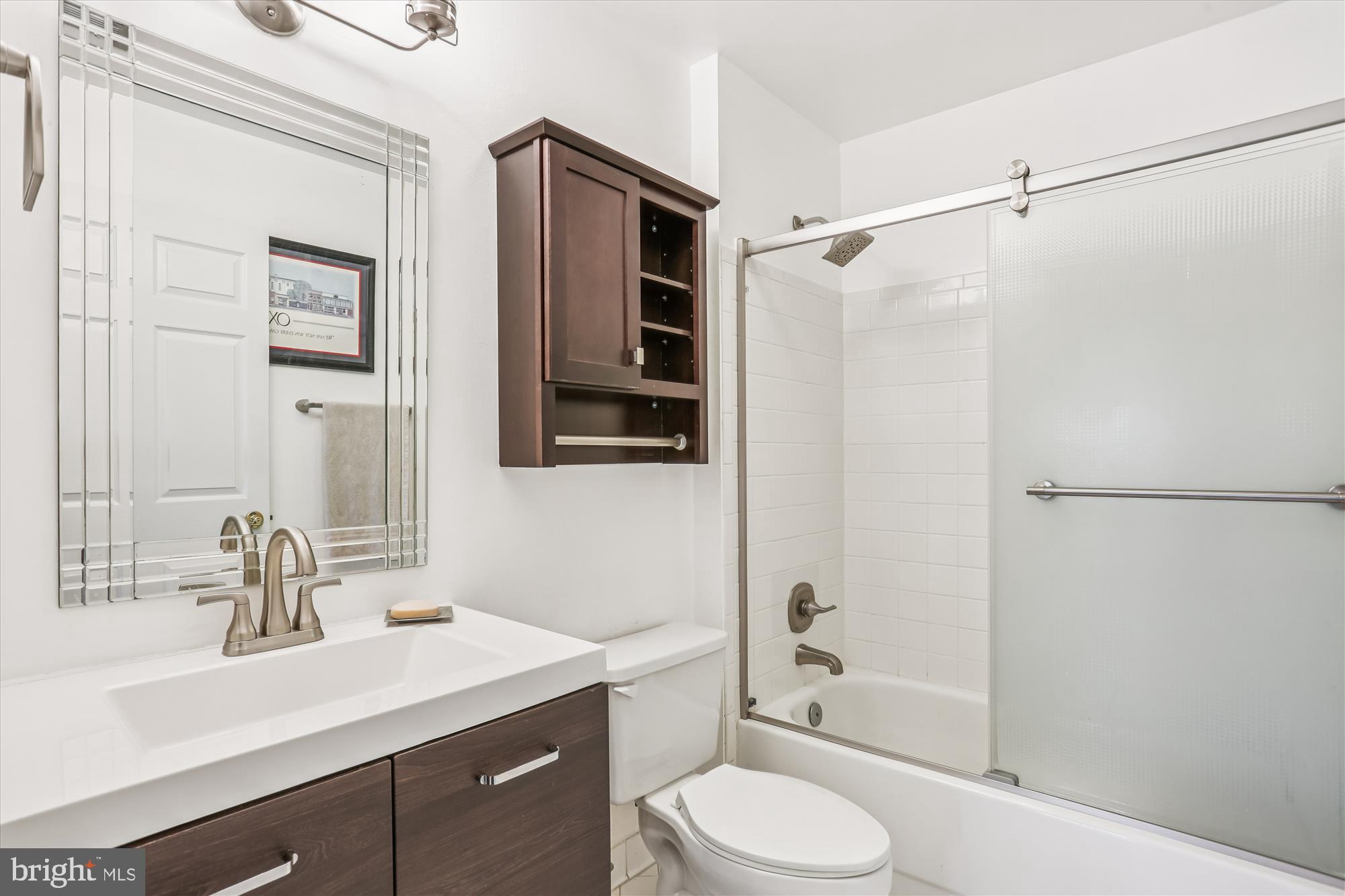 302 Ridgepoint Place, Unit 16 Gaithersburg, MD 20878 - Photo 22 of 40 a bathroom with a sink toilet and shower