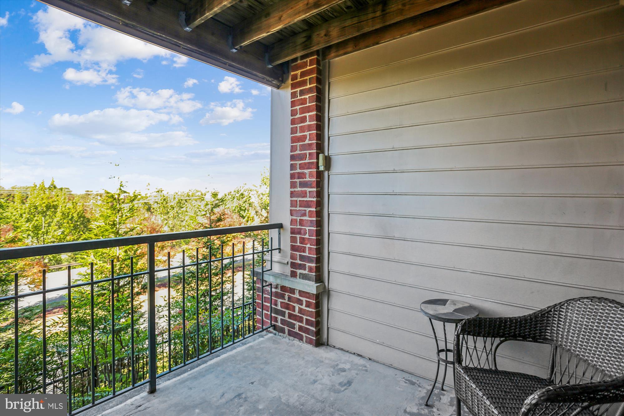 302 Ridgepoint Place, Unit 16 Gaithersburg, MD 20878 - Photo 24 of 40 a view of a balcony with furniture