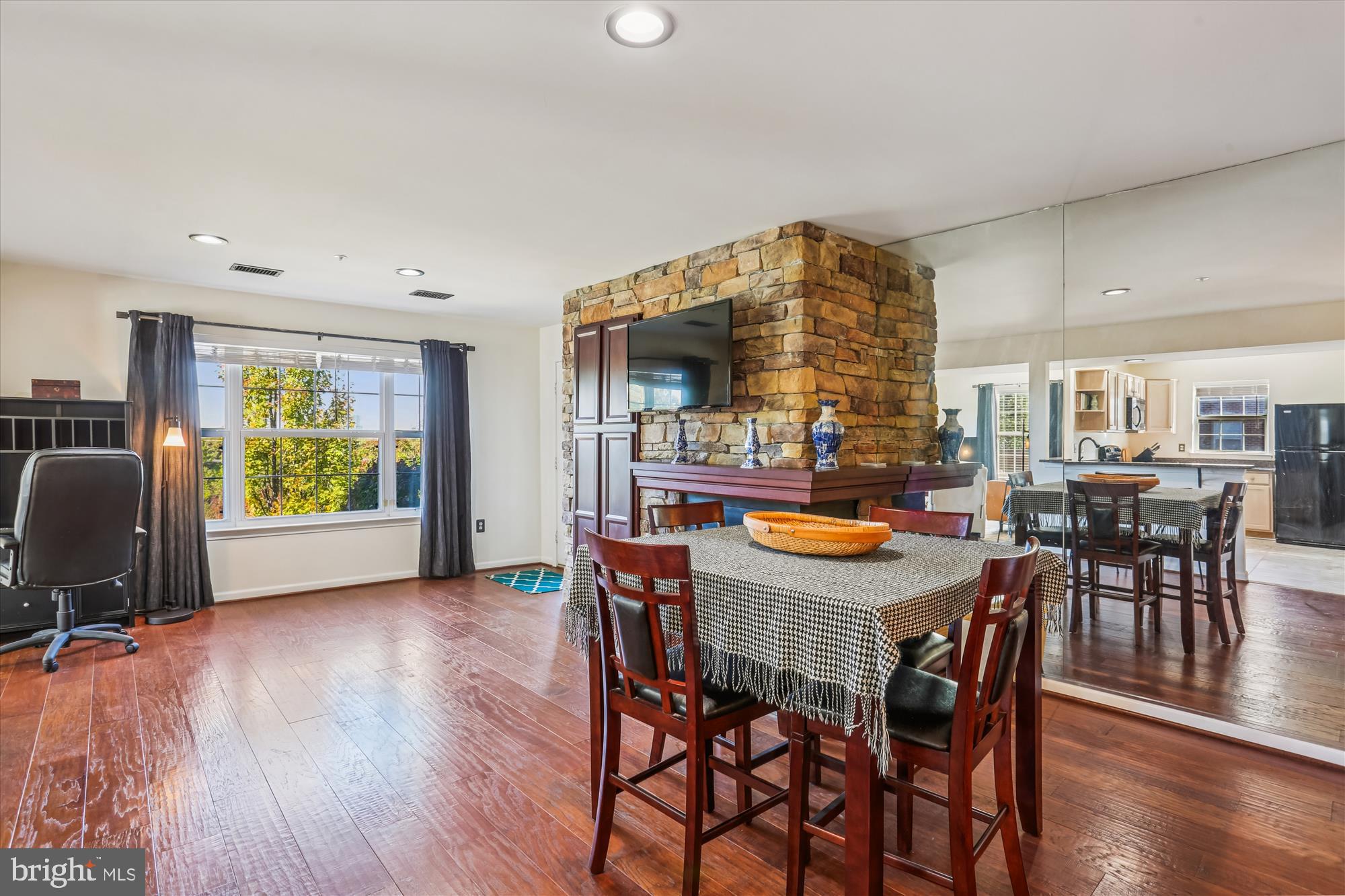 302 Ridgepoint Place, Unit 16 Gaithersburg, MD 20878 - Photo 3 of 40 a dining room with furniture and wooden floor