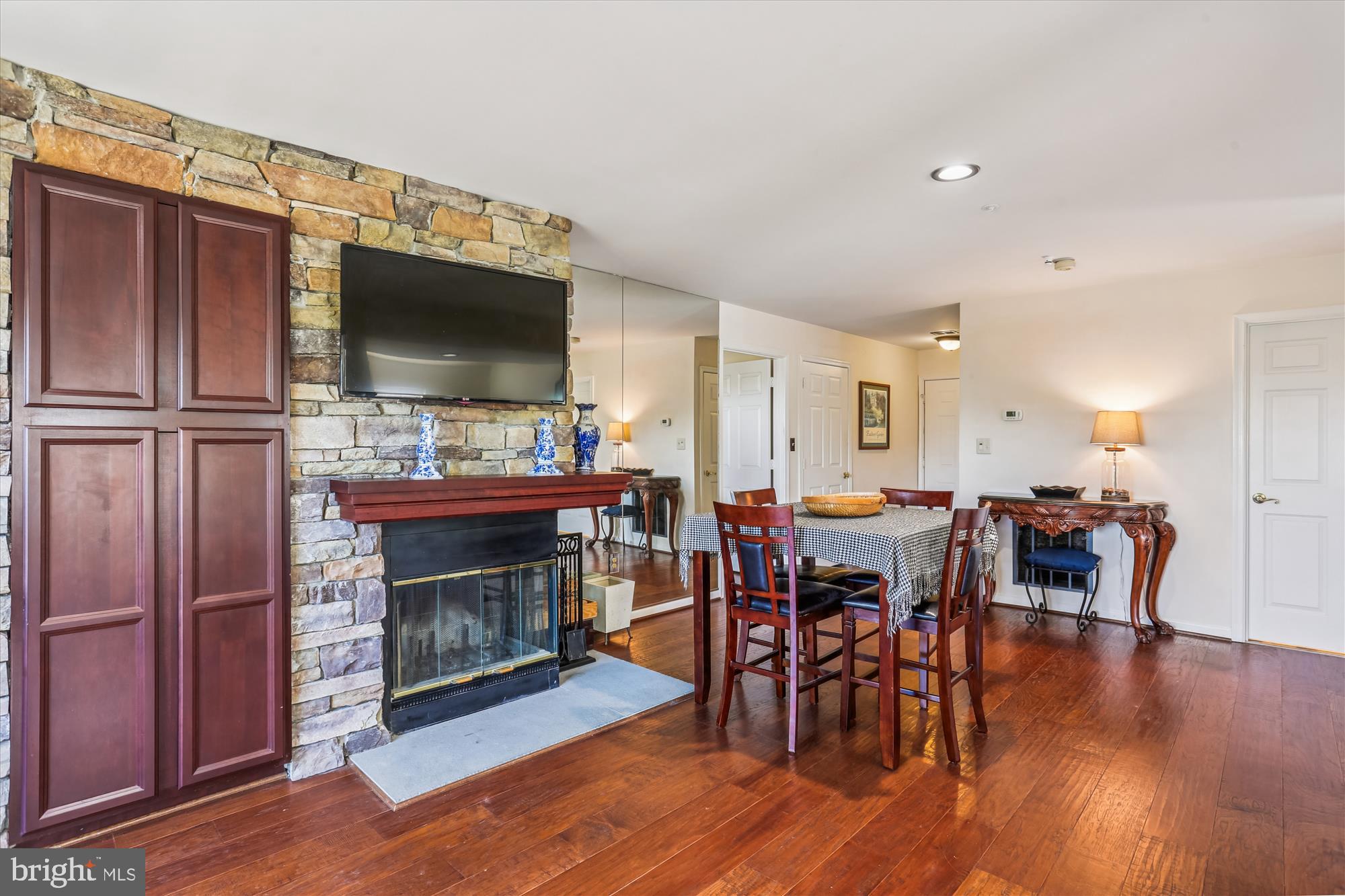 302 Ridgepoint Place, Unit 16 Gaithersburg, MD 20878 - Photo 4 of 40 a open kitchen with stainless steel appliances granite countertop a refrigerator dining table and chairs