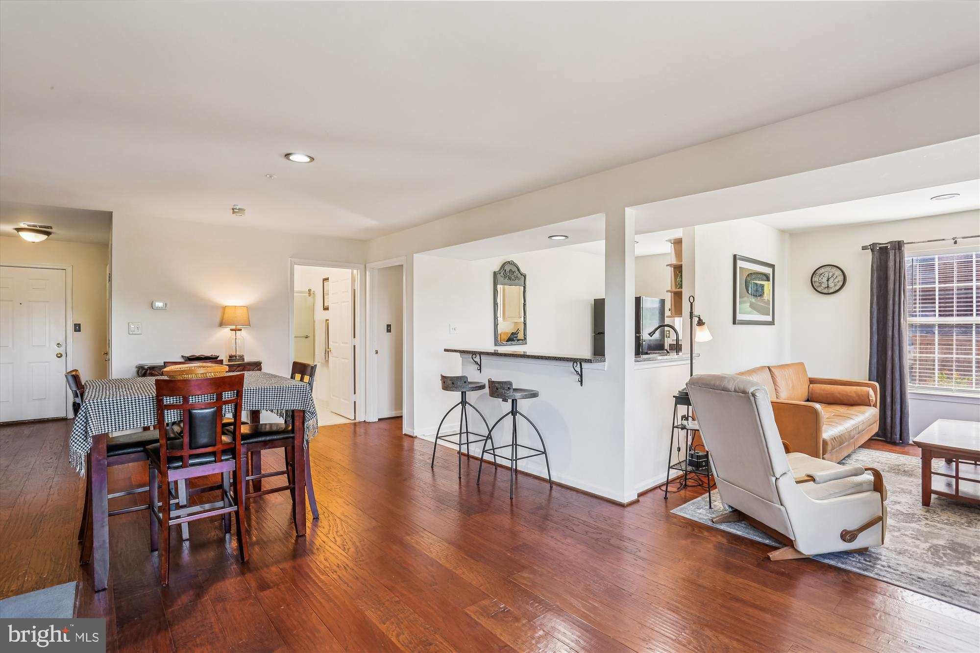 302 Ridgepoint Place, Unit 16 Gaithersburg, MD 20878 - Photo 5 of 40 a living room with furniture and wooden floor