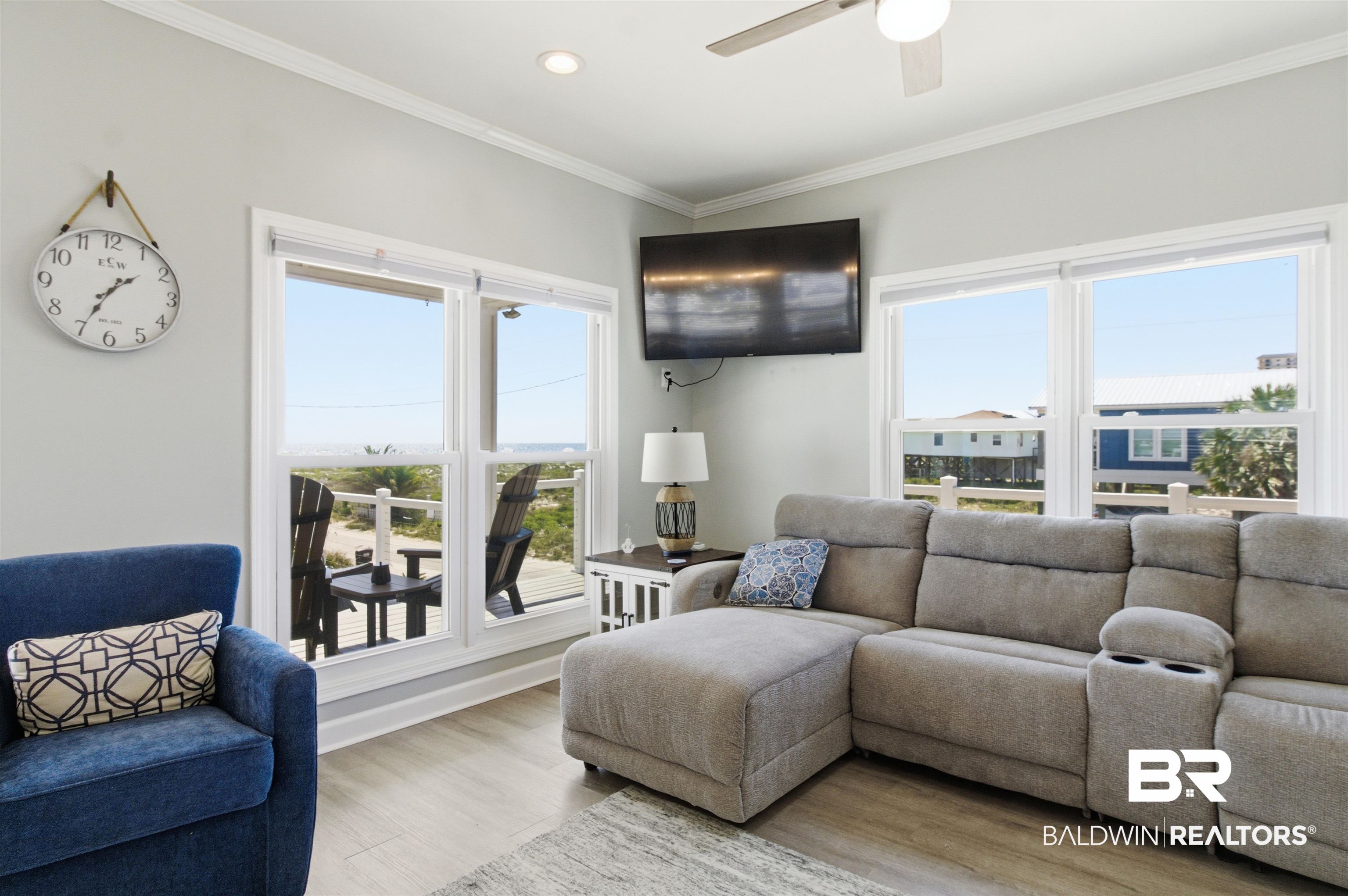 418 Veterans Road Gulf Shores, AL 36542 - Photo 38 of 51 Living room featuring ornamental molding, wood finished floors, plenty of natural light, ceiling fan, and recessed lighting