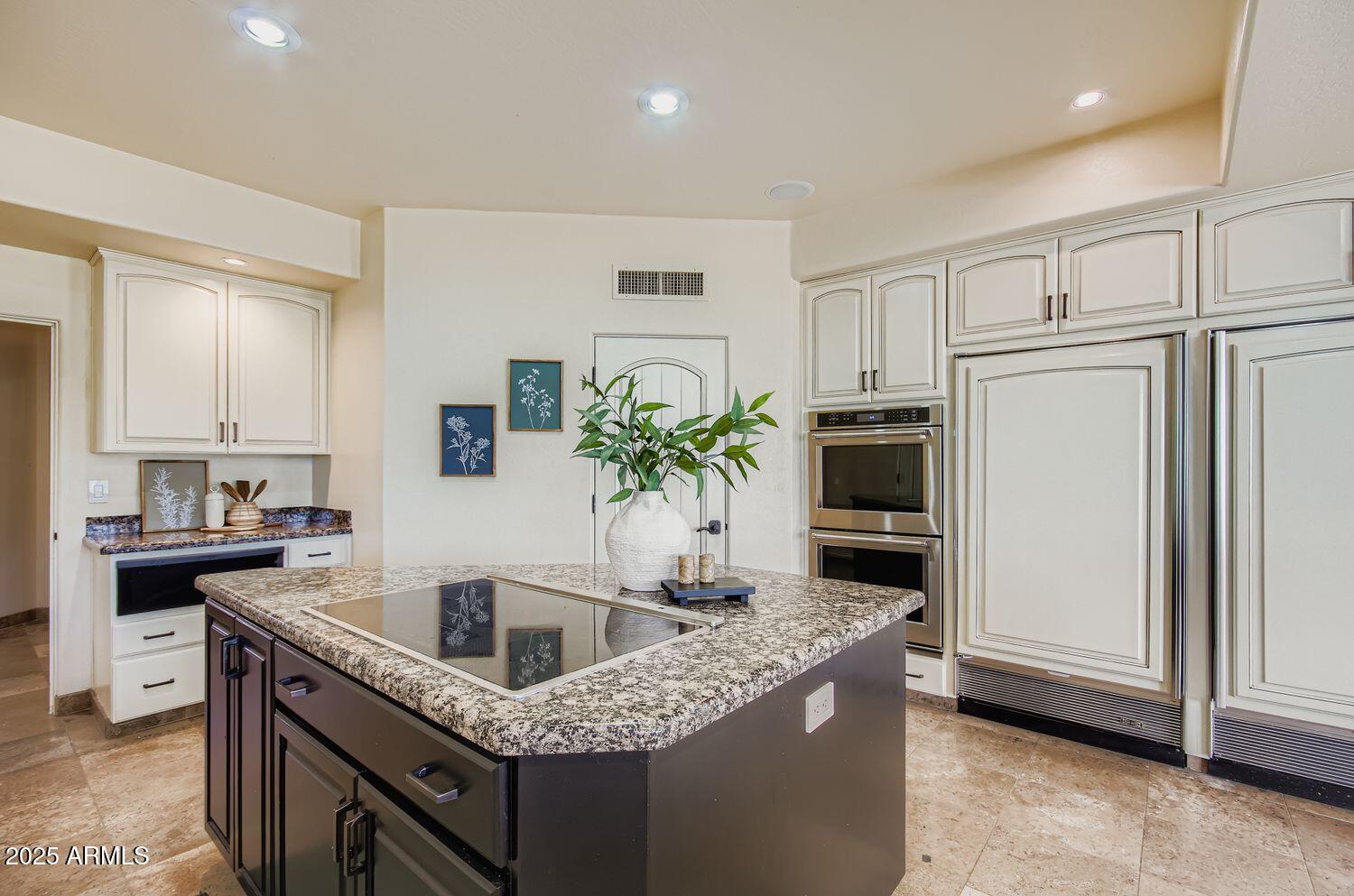 9247 North 24th Way Phoenix, AZ 85028 - Photo 13 of 99 a kitchen with granite countertop a sink a stove and refrigerator