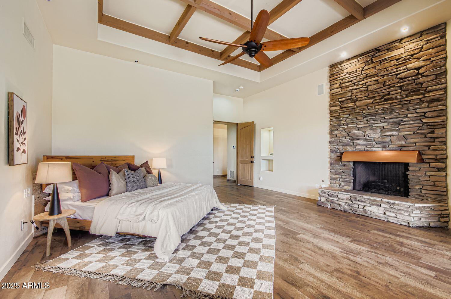 9247 North 24th Way Phoenix, AZ 85028 - Photo 21 of 99 a bedroom with a bed and a fireplace