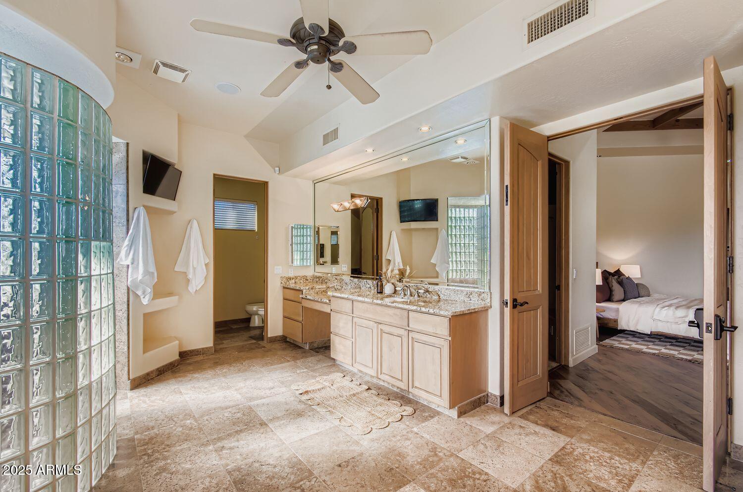9247 North 24th Way Phoenix, AZ 85028 - Photo 24 of 99 a large room with lots of wooden furniture and a chandelier
