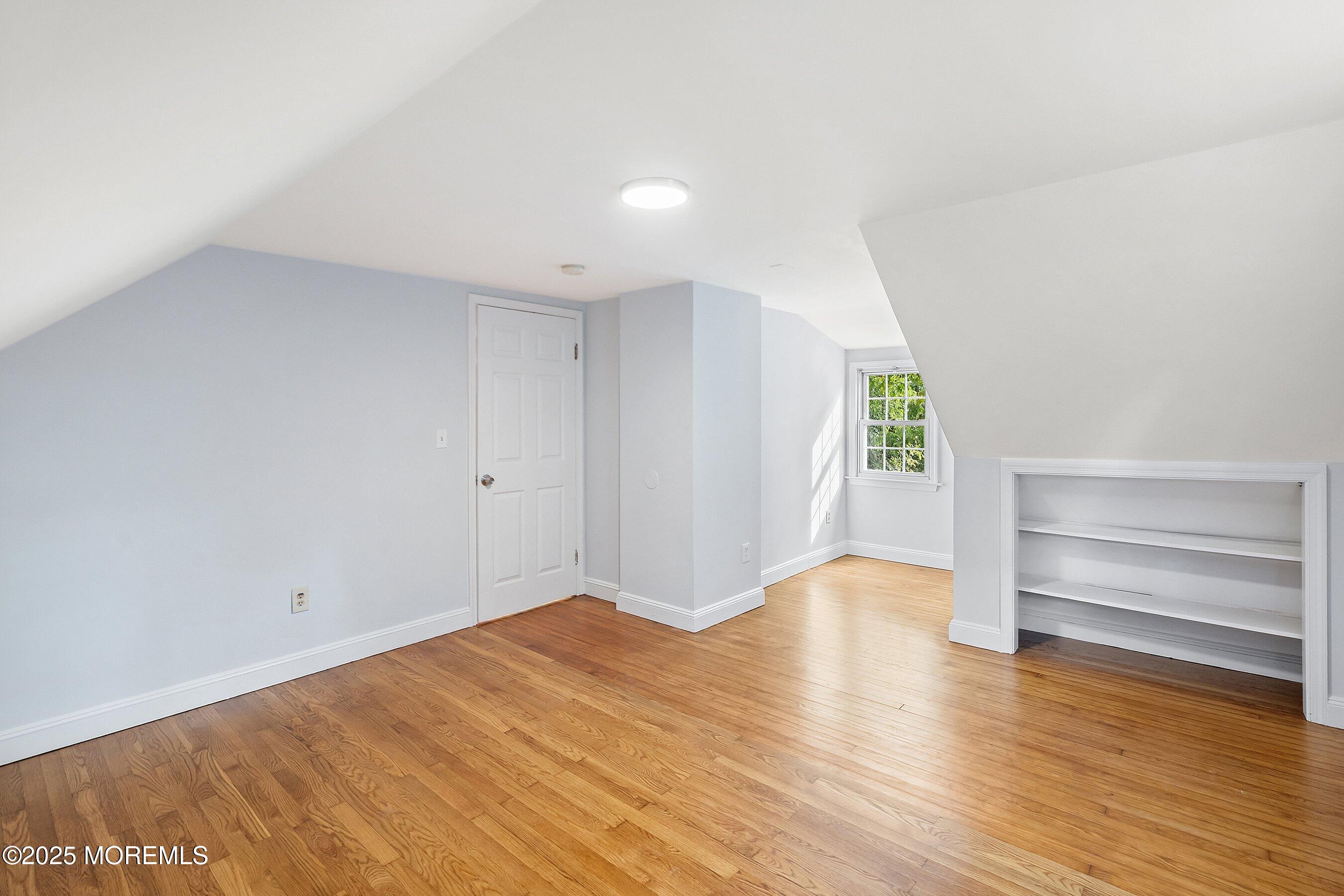 174 Alcoa Avenue Edison, NJ 08837 - Photo 13 of 20 wooden floor in an empty room with a window