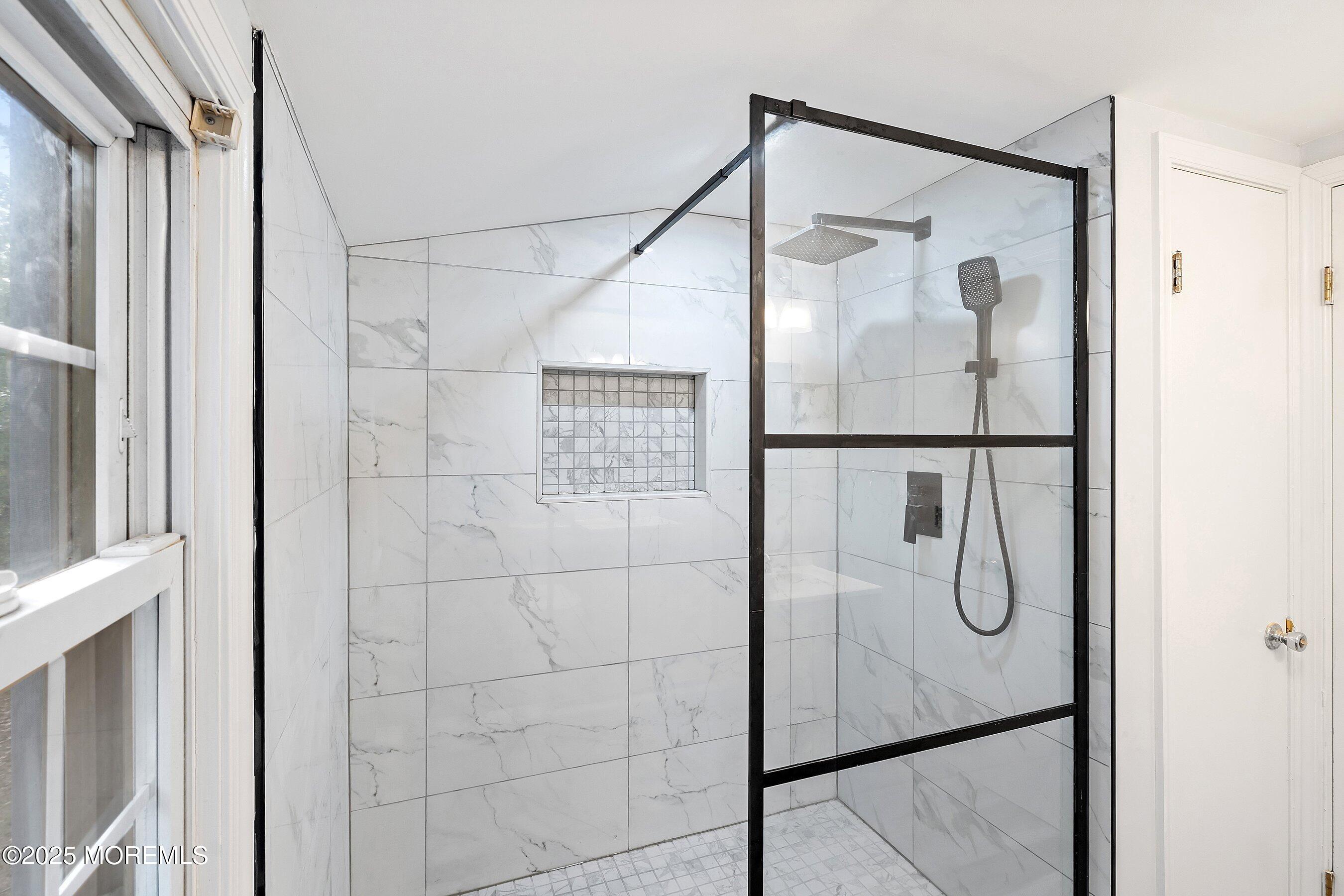 174 Alcoa Avenue Edison, NJ 08837 - Photo 15 of 20 a bathroom with a glass shower door