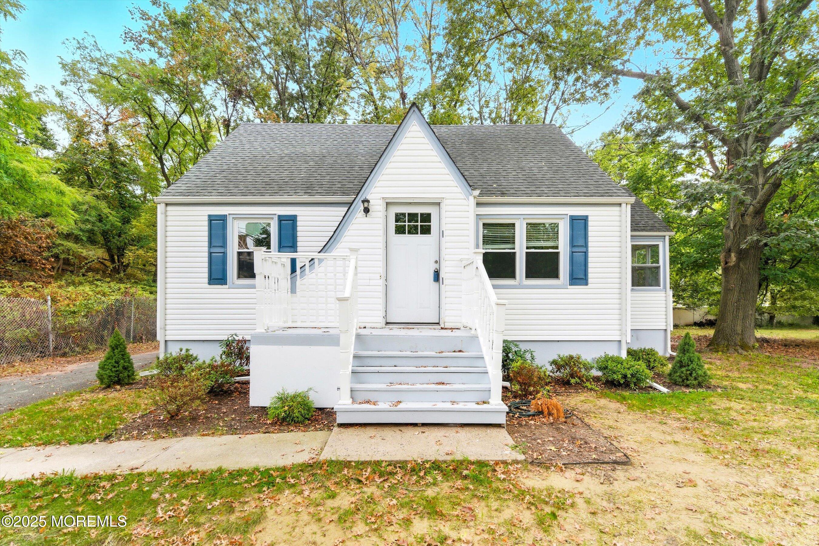 174 Alcoa Avenue Edison, NJ 08837 - Photo 2 of 20 a front view of a house with a yard and garage